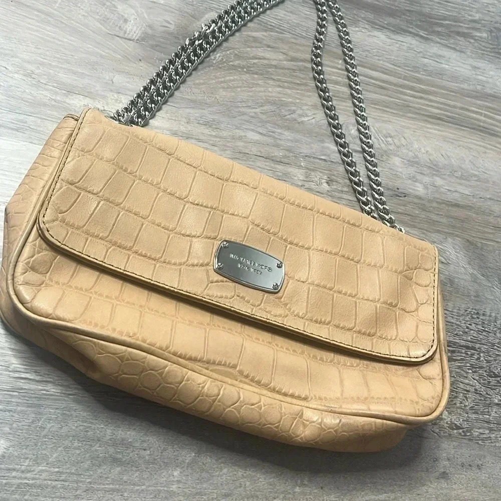Tan Michael Kors envelope chain crossbody purse with adjustable straps